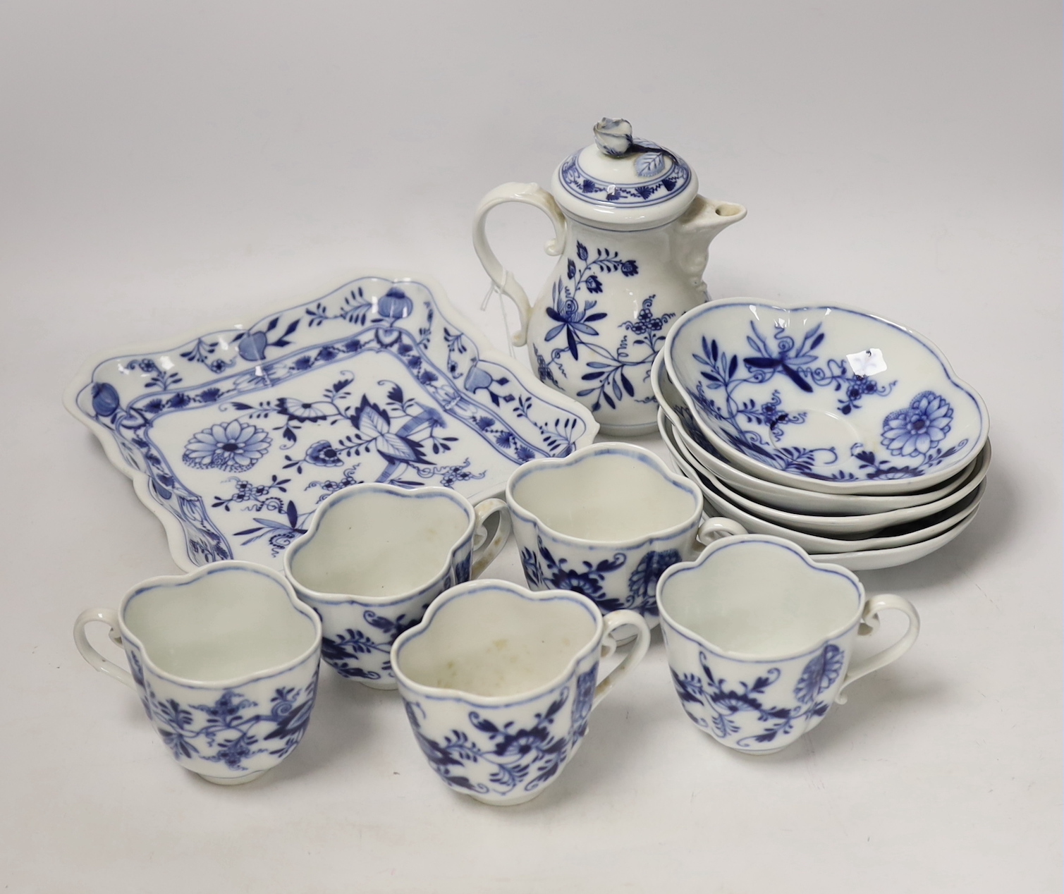 Fourteen Meissen items including a coffee pot, five cups and saucers, a square dish and oval dish, and a posy vase, coffee pot 16cm